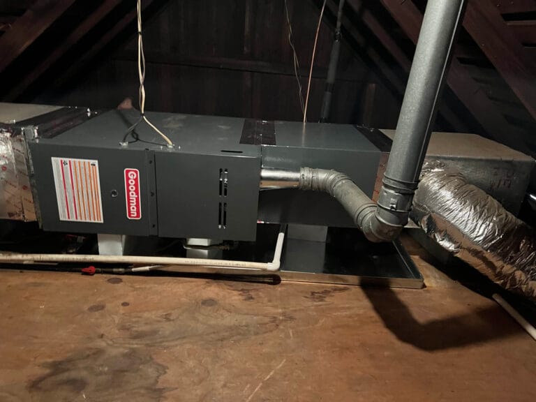 Heating and cooling system installed in an attic with visible ductwork and pipes, featuring dynamic content integration for real-time monitoring.