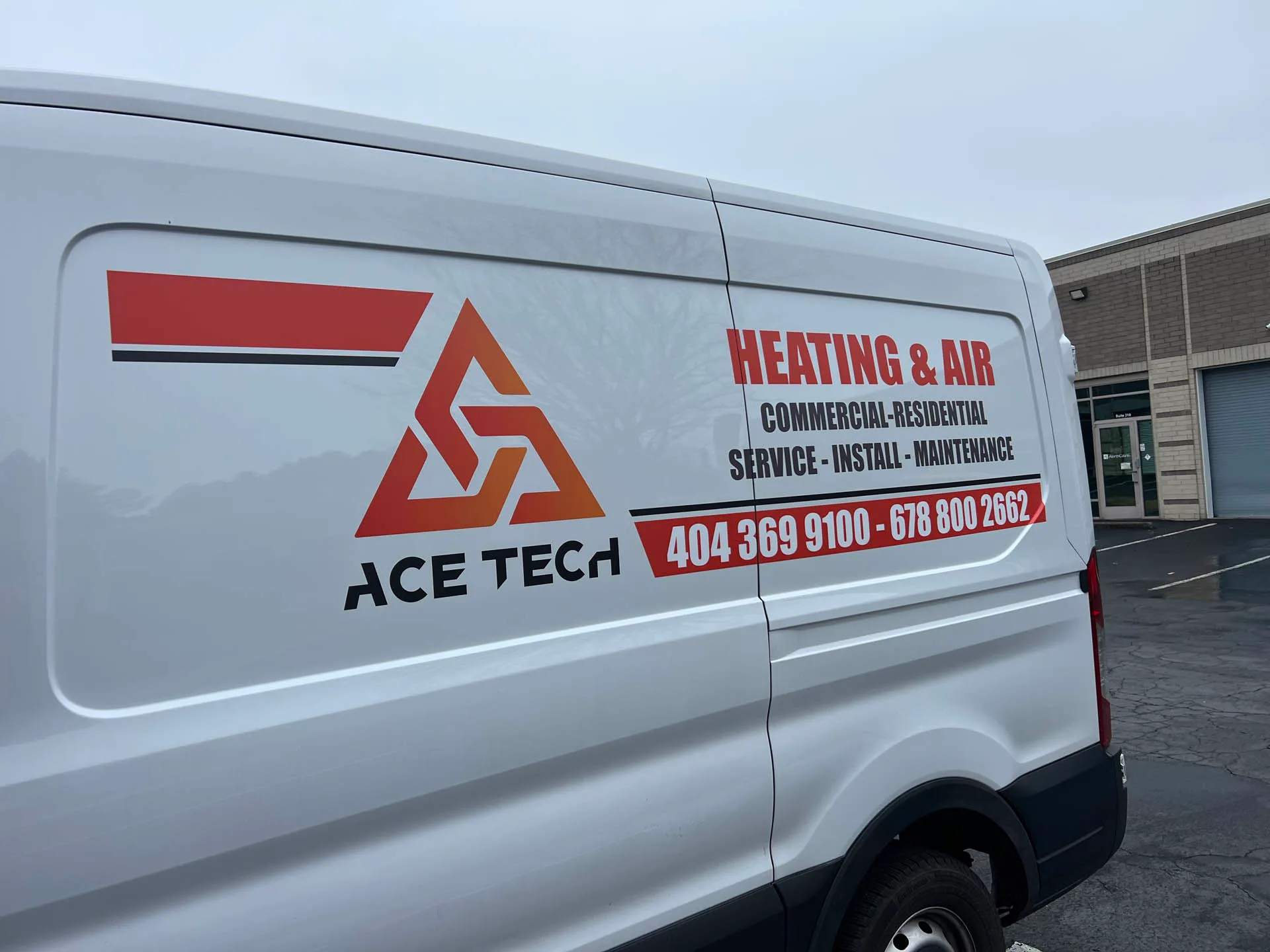 About 3 White van featuring the "Ace Tech" logo with "Heating & Air" services for both commercial and residential needs. Offering installation and maintenance, complete with two contact numbers. Perfect for those seeking dynamic content solutions in HVAC service advertising.