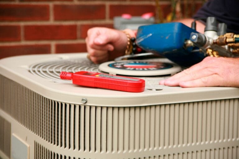 AC Repair & Maintenance 4 A technician provides expert air conditioning services, skillfully handling tools atop the unit.